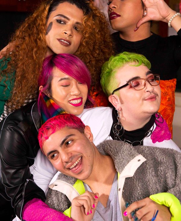 A group of friends of varying genders taking a photo at a party. (Credit: The Gender Spectrum Collection)